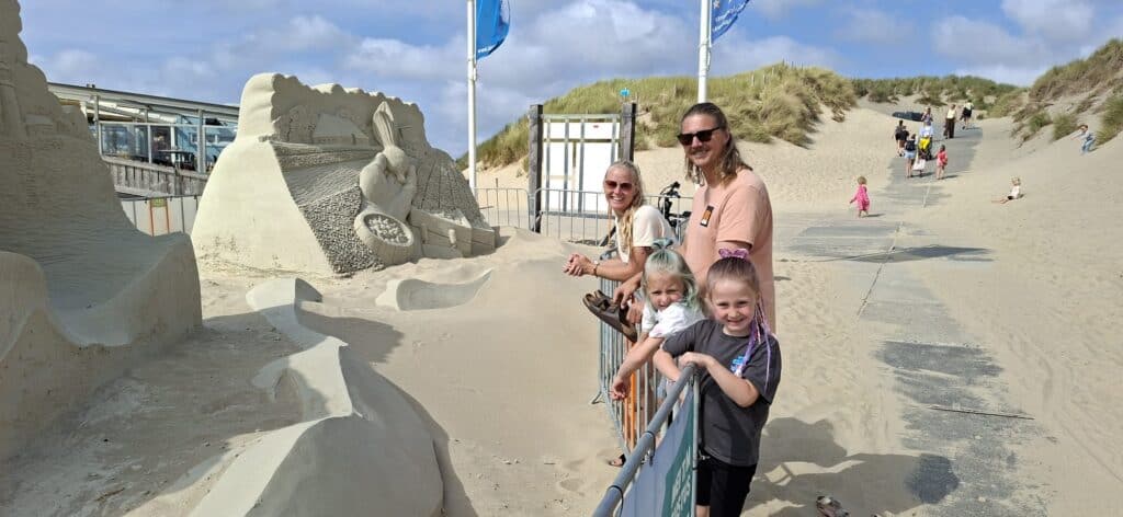 Laura and her family at the sand sculptures at Zee van Tijd